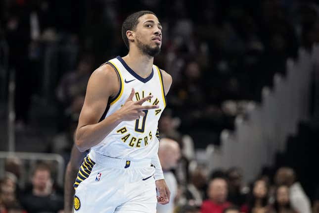 Nov 21, 2023; Atlanta, Georgia, USA; Indiana Pacers guard Tyrese Haliburton (0) reacts after a three point basket against the Atlanta Hawks during the first half at State Farm Arena.