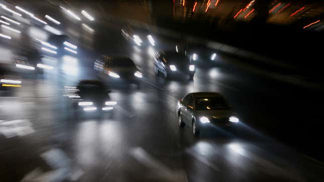 A photo of car headlights on a busy road at night. 