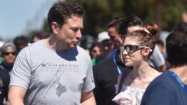 File photo of Elon Musk (left) and Grimes at the 2018 Space X Hyperloop Pod Competition, in Hawthorne, California on July 22, 2018.