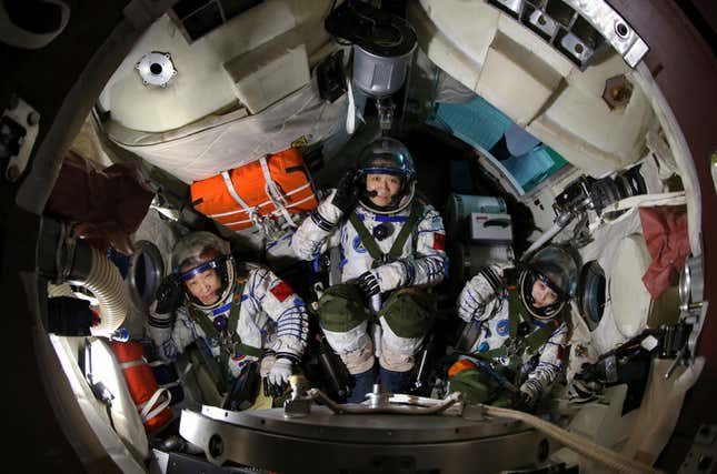 Chinese astronauts (from L to R) Zhang Xiaoguang, Nie Haisheng and Wang Yapin