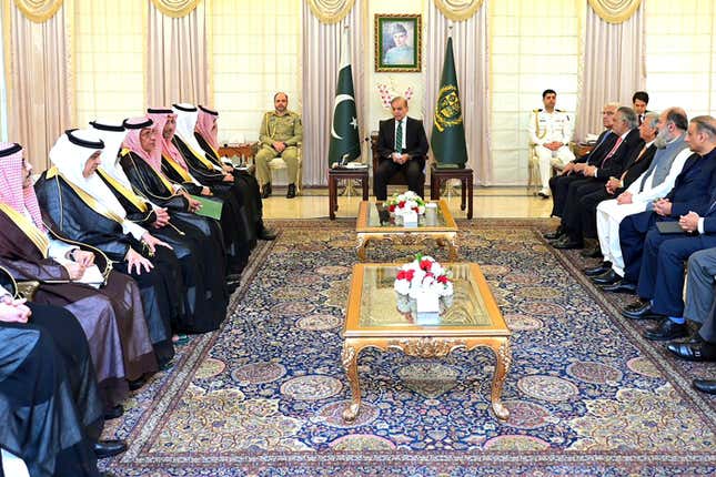 In this photo released by Prime Minister Office, visiting Saudi Foreign Minister Prince Faisal bin Farhan, seventh left, meets with Pakistan&#39;s Prime Minister Shehbaz Sharif, center, in Islamabad, Pakistan, Tuesday, April 16, 2024. Saudi Arabia&#39;s foreign minister led a high-level delegation on a two-day visit to Pakistan, which is seeking help in overcoming one of its worst economic crises. (Prime Minister Office via AP)