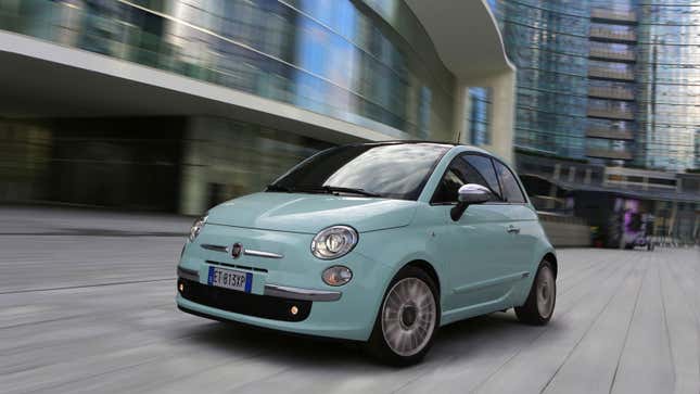 A fiat 500 hatchback in mint green