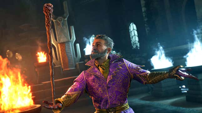 A man in a fancy suit balances a staff on his hand.