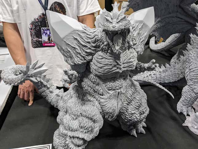 An unpainted statue of Space Godzilla sits on display.