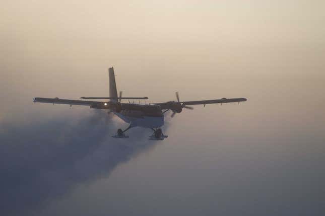 This photo shows a Twin Otter flies out of the South Pole on a previous medical flight in 2003. (National Science Foundation via AP/Jason Medley)