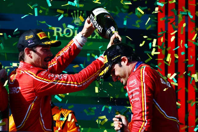 Race winner Carlos Sainz of Spain and Ferrari and Second placed Charles Leclerc of Monaco and Ferrari celebrate on the podium during the F1 Grand Prix of Australia at Albert Park Circuit on March 24, 2024 in Melbourne, Australia.