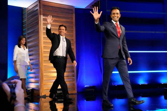 Republican presidential candidates from left, former UN Ambassador Nikki Haley, Florida Gov. Ron DeSantis, and businessman Vivek Ramaswamy aarrive on stage before a Republican presidential primary debate hosted by NBC News Wednesday, Nov. 8, 2023, at the Adrienne Arsht Center for the Performing Arts of Miami-Dade County in Miami. (AP Photo/Wilfredo Lee)