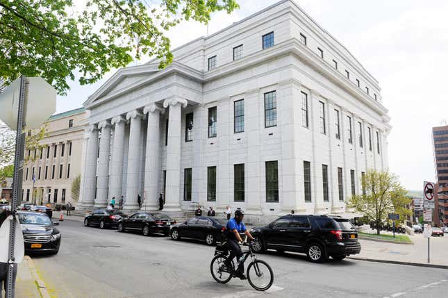 FILE - A cyclist rides past the New York Court of Appeals on May 5, 2015, in Albany, N.Y. New York&#39;s highest court on Tuesday, Oct. 24, 2023, ruled police can resume a DNA searching method that can identify relatives of potential suspects, a technique that has helped solve crimes but caused privacy concerns. (AP Photo/Hans Pennink, File)