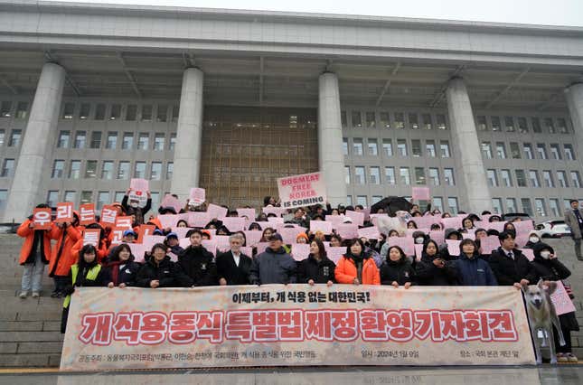 Animal rights activists attend a protest rally supporting the government-led dog meat banning bill at the National Assembly in Seoul, South Korea, Tuesday, Jan. 9, 2024. South Korea&#39;s parliament on Tuesday passed a landmark ban on production and sales of dog meat, as public calls for a prohibition have grown sharply over concerns about animal rights and the country&#39;s international image.(AP Photo/Ahn Young-joon)