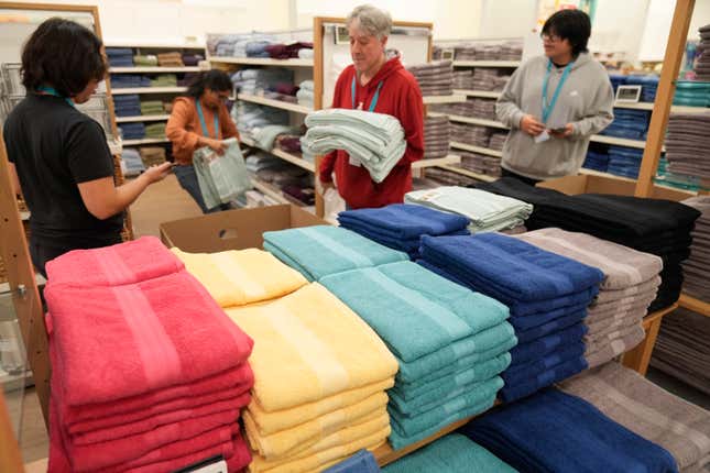 FILE - Employees arrange a display at a Kohl&#39;s store in Clifton, N.J., Jan. 26, 2024. On Thursday, March 14, 2024, the Commerce Department releases U.S. retail sales data for February. (AP Photo/Seth Wenig, File)