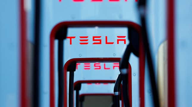 Abstract photo of EV car chargers with the Tesla logo 