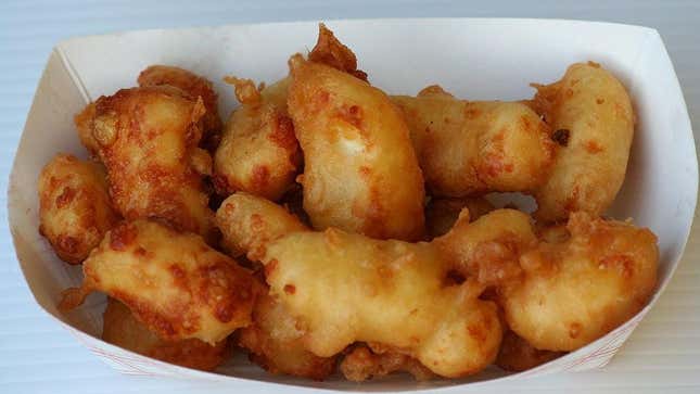 Fried cheese curds in paper basket