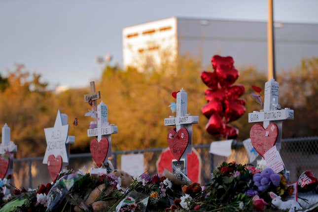 FILE - A memorial is made outside the Marjory Stoneman Douglas High School where 17 students and faculty were killed in a mass shooting in Parkland, Fla, Feb. 19, 2018. A California property manager was sentenced, Friday, Oct. 20, 2023, to a year in federal prison for sending more than 200 vile online messages to the father of a teenage girl who died in the 2018 massacre at Parkland&#39;s Marjory Stoneman Douglas High School. (AP Photo/Gerald Herbert, File)