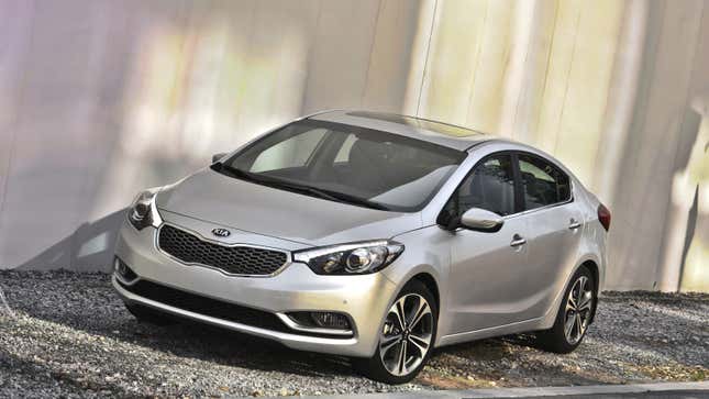 A photo of a silver Kia Forte sedan. 