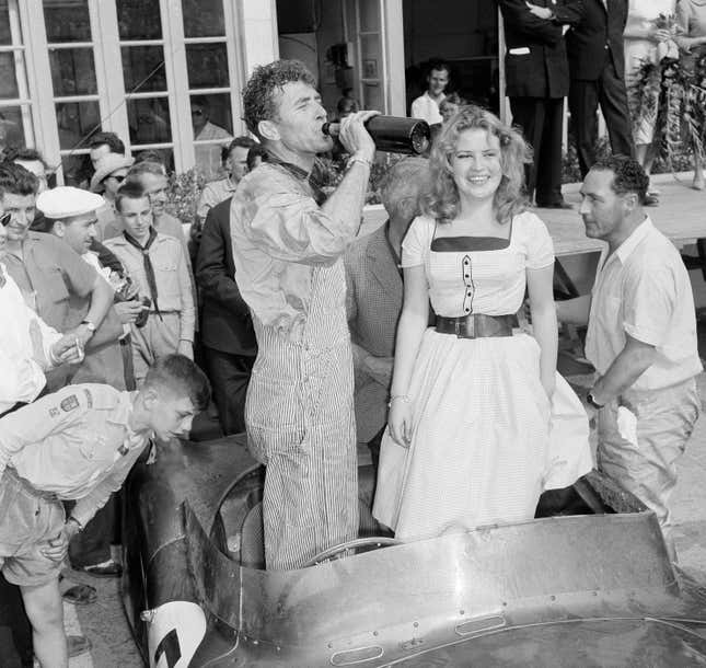 Carroll Shelby celebrates winning the 24 Hours of Le Mans.