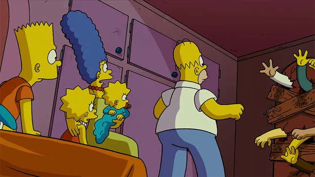 The Simpsons family in the Simpsons movie, barricading their front door. 