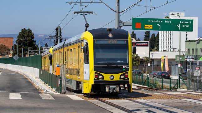 A metro train, traveling on the new K Line, makes its way along Crenshaw Blvd. in Los Angeles, during a test run.