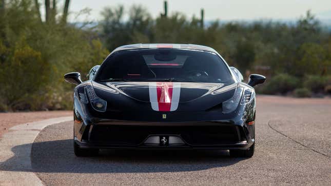 A photo of a black Ferrari 458 supercar. 