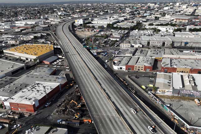 FILE - In this aerial view, Interstate 10 is empty due to a closure in the aftermath of a fire, Monday, Nov. 13, 2023, in Los Angeles. Three months after an arson fire at a state-leased storage space shut down a major Los Angeles freeway, California transportation officials are recommending changes to the leasing program. (AP Photo/Jae C. Hong, File)