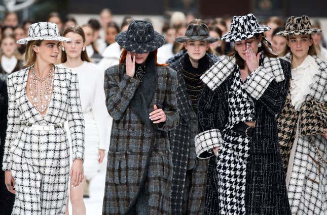 Cara Delevingne and other models react while presenting creations by late designer Karl Lagerfeld as part of his Fall/Winter 2019-2020 women's ready-to-wear collection show for fashion house Chanel at the Grand Palais during Paris Fashion Week in Paris, France March 5, 2019. REUTERS/Regis Duvignau - RC16CF484BB0