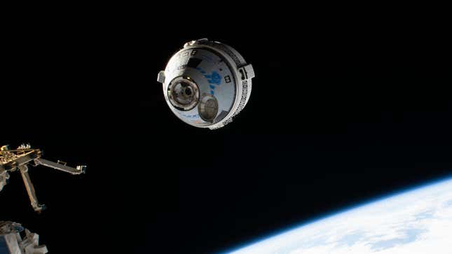 A photo of Starliner docking with the Space Station. 