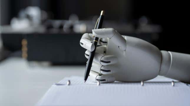 A robot hand writing with a pen. 