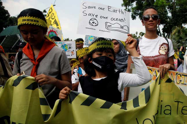 A girl holds a placard as she takes part in Global Climate Strike rally in Jakarta, Indonesia, Sept. 20.