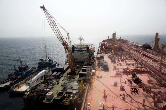 FILE - Technical vessels are seen by the decrepit Safer tanker on Monday, June 12, 2023, off the coast of Yemen. The Safer had posed an environmental threat since 2015, as it decayed and threatened to spill its contents of 1.14 million barrels into the Red Sea and Indian Ocean. After years of alarm and negotiations, the Safer’s oil was transferred onto another tanker in August. (AP Photo/Osamah Abdulrahman, File)