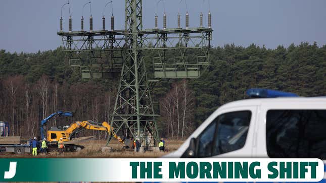 A police van stands near an electricity pylon that delivers electricity to the nearby Tesla factory and that was recently sabotaged on March 07, 2024 near Gruenheide, Germany