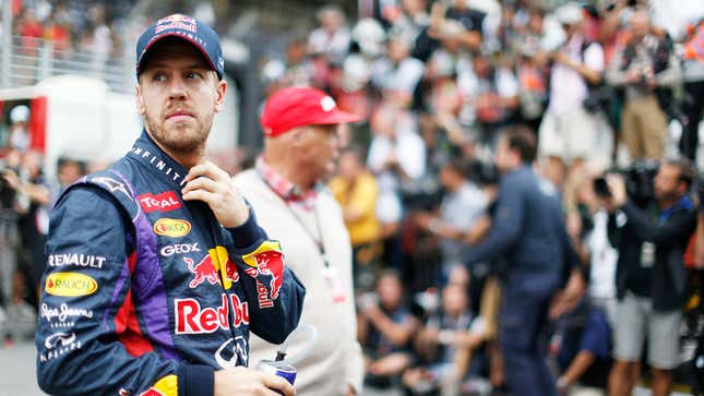 A photo of Sebastian Vettel wearing his Red Bull overalls. 