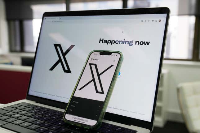 The opening page of X is displayed on a computer and phone in Sydney, Monday, Oct. 16, 2023. Australia&#39;s online safety watchdog has fined X, formerly known as Twitter, $385,000 for failing to explain how it tackles child sexual exploitation on the social media platform. (AP Photo/Rick Rycroft)