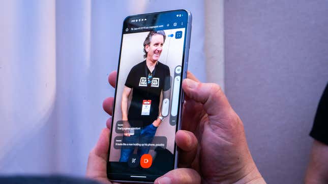 A photo of a person holding up the pixel 8 pro and project astra identifying that a person has a phone in their hand