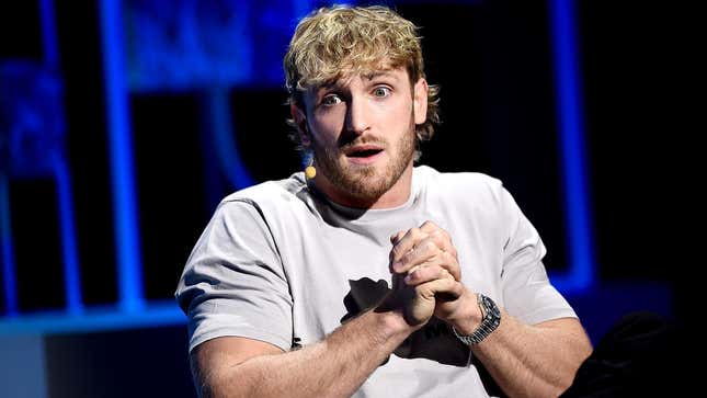YouTuber Logan Paul sits with his hands clasped at the Wall Street Journal The Future of Everything presentation in May 2022.