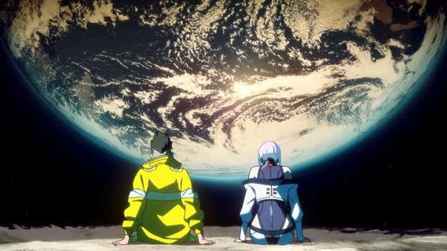 A man in a yellow jacket and a woman with white hair sit on the moon looking out over Earth