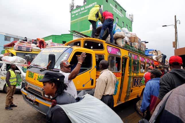 Passengers gather to use public bus transport as they travel to the countryside ahead of next week's general election in Nairobi, Kenya August 3, 2017.