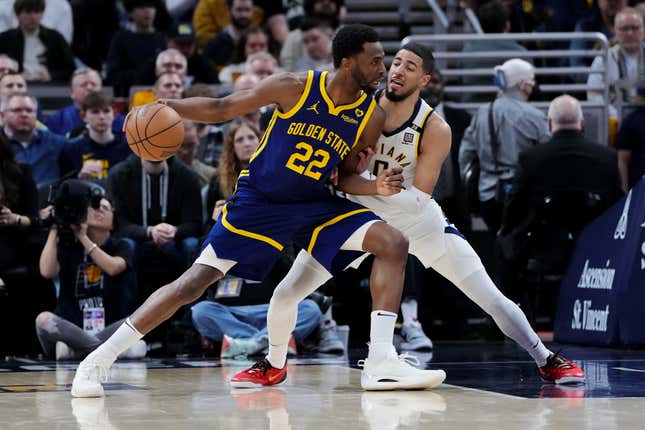 INDIANAPOLIS, INDIANA - FEBRUARY 08: Andrew Wiggins #22 of the Golden State Warriors posts up against Tyrese Haliburton #0 of the Indiana Pacers in the second quarter at Gainbridge Fieldhouse on February 08, 2024 in Indianapolis, Indiana. NOTE TO USER: User expressly acknowledges and agrees that, by downloading and or using this photograph, User is consenting to the terms and conditions of the Getty Images License Agreement. (Photo by Dylan Buell/Getty Images)