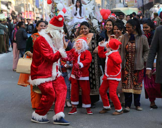 Photos of Christmas preparations, Santa Claus masks in India