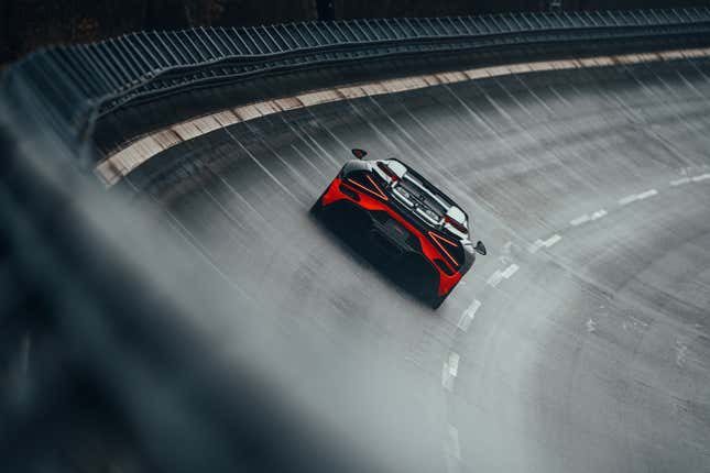 Rear view of the black and orange Bugatti W16 Mistral World Record Car on track