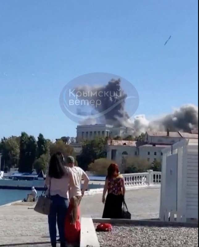 This UGC image shows the moment a missile hits the headquarters of the Russian Black Fleet, in Sevastopol, Friday, Sept. 22, 2023. (Crimean Telegram channel via AP)