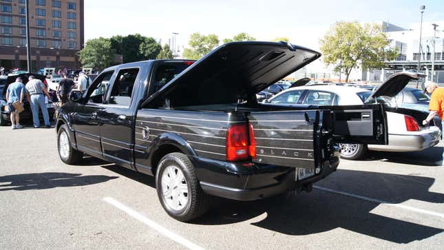 A Lincoln Blackwood pickup with the bed cover and both barn doors open