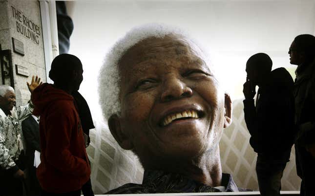 FILE - Giant photographs of former South African President Nelson Mandela are displayed at the Nelson Mandela Legacy Exhibition at the Civic Centre in Cape Town, South Africa, on June 27, 2013. The South African government announced Friday Jan. 19, 2024 it will challenge the auctioning of dozens of artifacts belonging to the nation&#39;s anti-apartheid stalwart Nelson Mandela, saying the items are of historical significance and should be preserved in the country. (AP Photo, File)