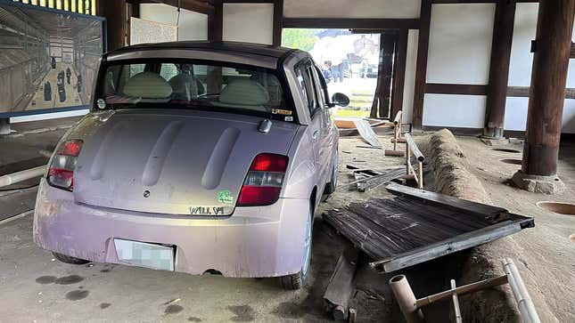 A Toyota WiLL Vi and a WiLL Vi-sized hole in the door of a 15th-century Japanese communal toilet