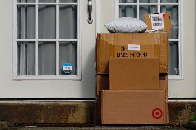 File - Packages are stacked on the doorstep of a home on Oct. 27, 2021, in Upper Darby, Pa. Retailers and delivery companies have been trying to combat the theft of delivered packages in a variety of ways. (AP Photo/Matt Slocum, File)