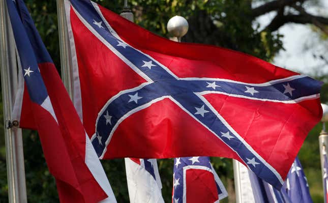 In this July 19, 2011, file photo, Confederate battle flags fly outside the museum at the Confederate Memorial Park in Mountain Creek, Ala.