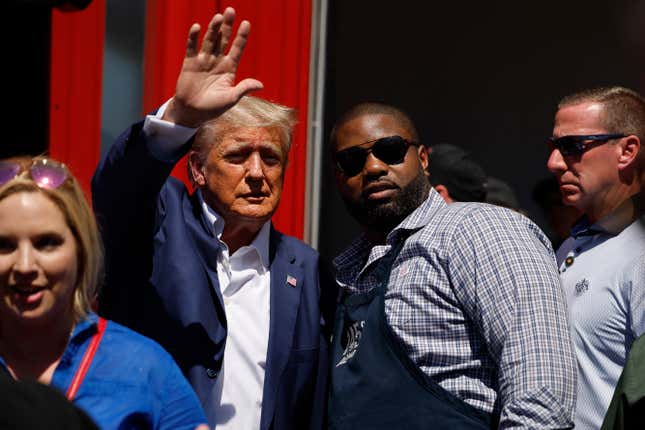 DES MOINES, IOWA - AUGUST 12: Former U.S. President Donald Trump visits the Iowa Pork Producers Tent with Rep. Byron Donalds (R-FL) at the Iowa State Fair on August 12, 2023 in Des Moines, Iowa. Republican and Democratic presidential hopefuls are visiting the fair, a tradition in one of the first states that will test candidates with the 2024 caucuses.