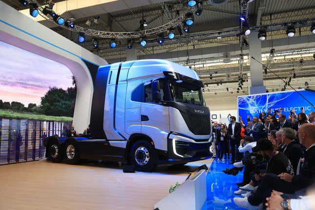 Visitors watch the unveiling of a Nikola Corp. Tre FCEV truck at the IAA Transportation show in Hanover, Germany, on Monday, Sept. 19, 2022.