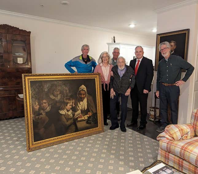 Special Agent Gary France, second right,, Dr. Francis Wood and Wood’s children stand next to the John Opie painting that was stolen from Wood’s parents&#39; home in 1969 in Newark, N.J.,on Thursday, Jan. 11, 2024. The 18th-Century John Opie painting stolen by mobsters in 1969 with help from a New Jersey state lawmaker has been returned more than 50 years later, the FBI’s Salt Lake City field office announced Friday, Jan. 26. (FBI via AP)