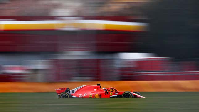 A photo of a red Ferrari testing at a track in Italy. 