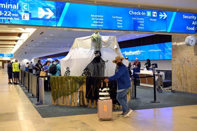 People line up to check in at Orland International Airport