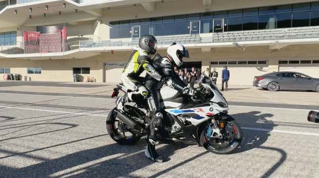 Two people on the back of a BMW motorcycle